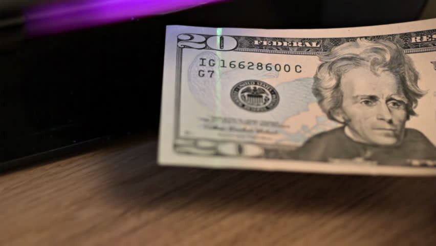 US 20 Dollar bill under UV light