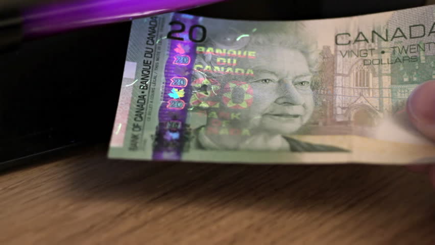 Canadian Dollars under UV light