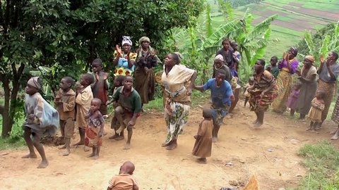 LAKE BUNYONYI, UGANDA - OCTOBER 21: Batwa pygmies dancing on October 21, 2012 at Lake Bunyonyi, Uganda. Pygmy people are ancient dwellers in the forests, they were known as The Keepers of the Forest.