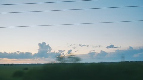 view from moving train on TRANS-Siberian railway at sunset