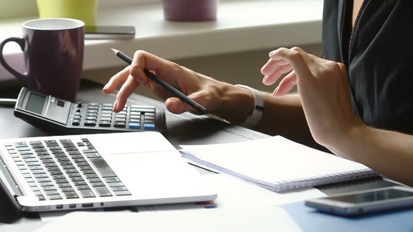 Close up of female accountant or banker making calculations. Home finances, investment, economy, saving money or insurance concept. Hands closeup. Royalty-Free Stock Footage #19478605