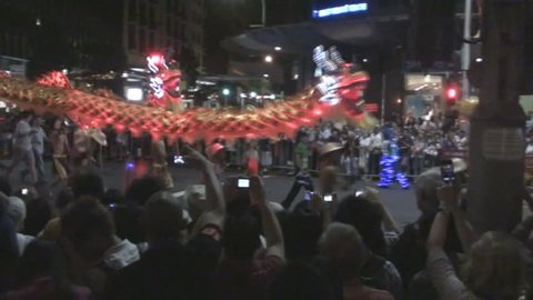 SYDNEY, AUSTRALIA - JANUARY 29: Entertainers carry traditional Chinese Dragons through Sydney's George Street on January 29, 2012 as part of the "Twilight Parade" of the Chinese New Year Festival