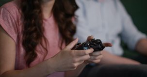 4k, Young bored man sitting on sofa while a woman plays video game