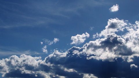 A beautiful time lapse of clouds against a very blue sky.