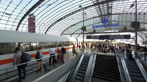 Berlin, Germany - September 9, 2016: Traveling people at main train station (Berlin Hauptbahnhof) - time lapse.