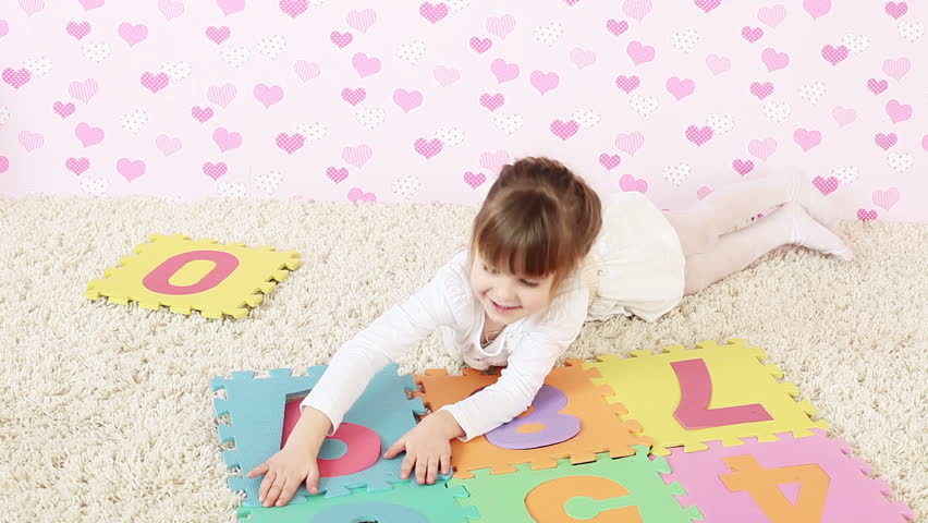 Young girl playing on the floor