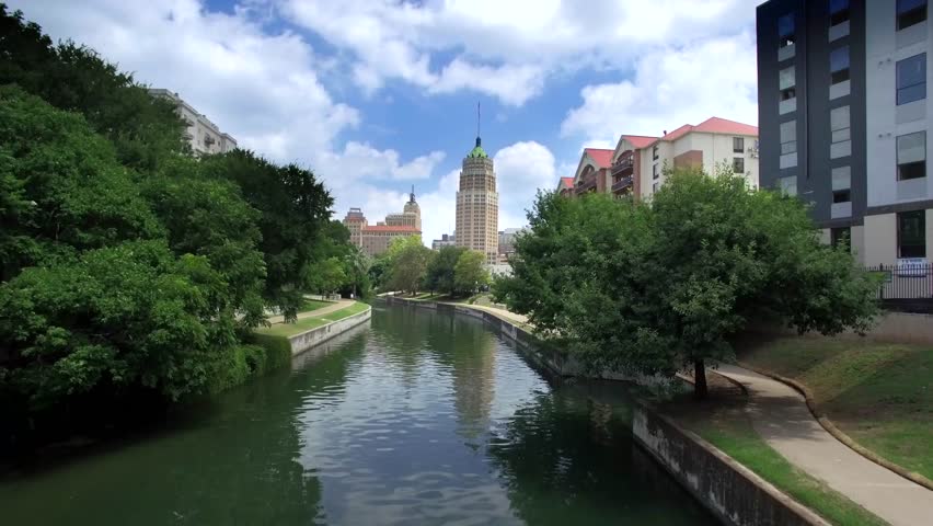 Aerial view of San Antonio riverwalk by skyline under sunny blue sky 2