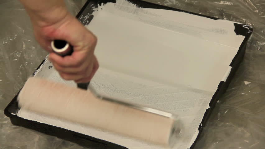 pouring paint into roller tray rolling Stock Footage Video (100% ...