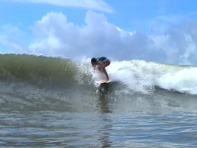 Brazilian surfer catching a wave