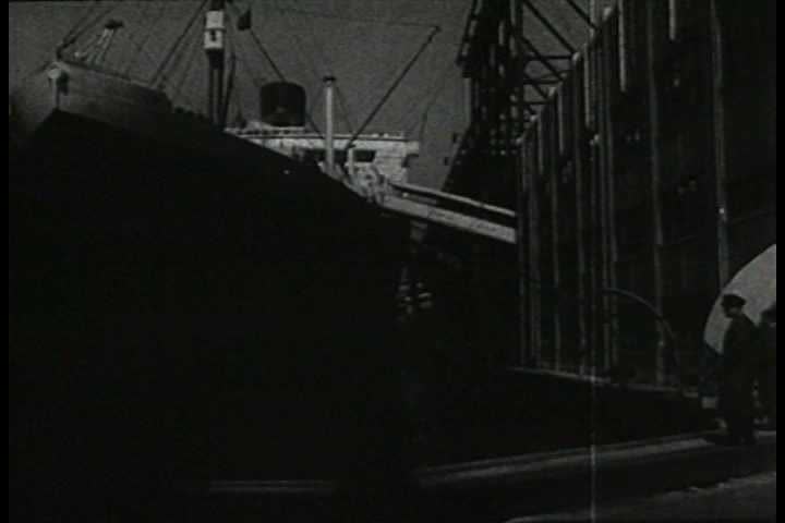 A man tries to open a door in a ship but it explodes in 1941. (1940s) | Shutterstock HD Video #19506463