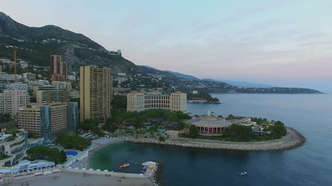 MONTE CARLO, MONACO - AUG 02, 2016: Townscape with Larvotto beach near Meridian Beach Plaza hotel, Le Bahia, Les Villas Du Sporting and Sporting Monte-Carlo at summer evening. Aerial view
