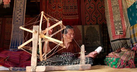 North Toraja, Sulawesi, Indonesia-Aug 28, 2016-Toraja traditional weaving clothes by old  women in Sa'dan To'Barana village Rantepao. Weave clothes become an important heritage from Indonesia.