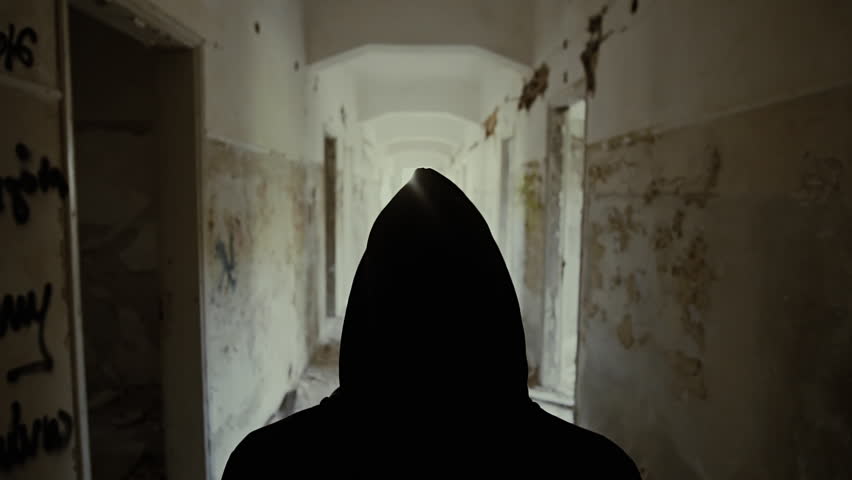 Hooded young man wondering inside destroyed abandoned building,slow motion,dramatic.Young man with social issues, walks inside a big wrecked empty building in 100fps slow motion.Camera gimbal motion. Royalty-Free Stock Footage #19538122