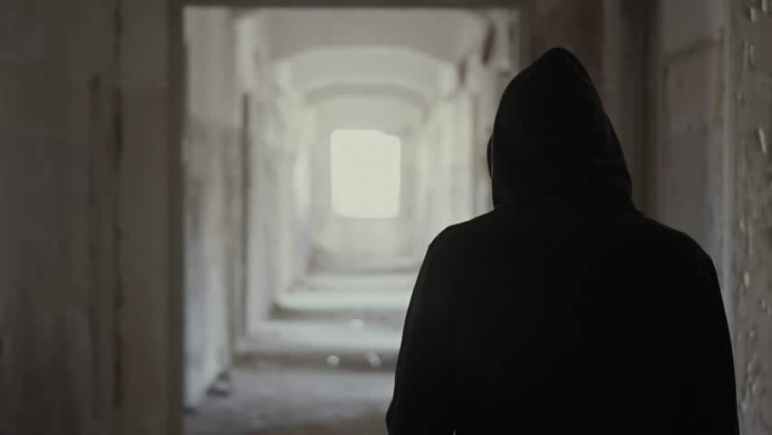 Hooded young man wondering inside destroyed abandoned building,slow motion,dramatic.Young man with social issues, walks inside a big wrecked empty building in 100fps slow motion.Camera gimbal motion. Royalty-Free Stock Footage #19538128