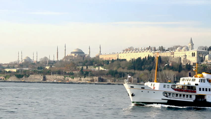 Istanbul ferry sails in front of Sarayburnu. Three landmarks seen in the