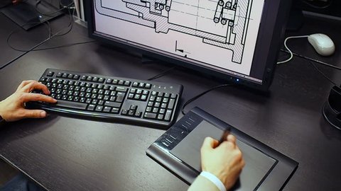 Tablet 38. Close up of the hand of a engineer editing scheme in CAD system, signed dimension on LCD monitor, holding an electronic stylus.