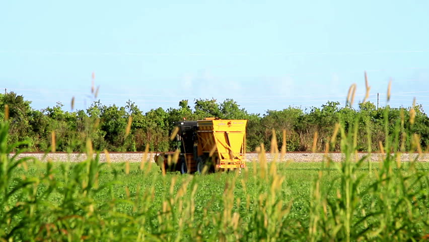 agriculture machinery moves through field