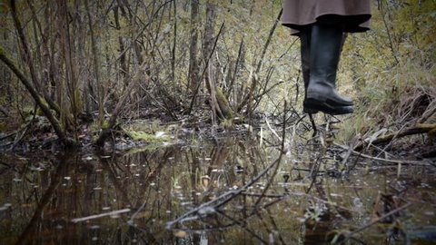 feet of hanged man over the rotten swamp, horizontal camera movement
