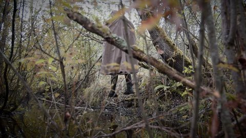 hanged man in the gloomy wood, horizontal camera movement