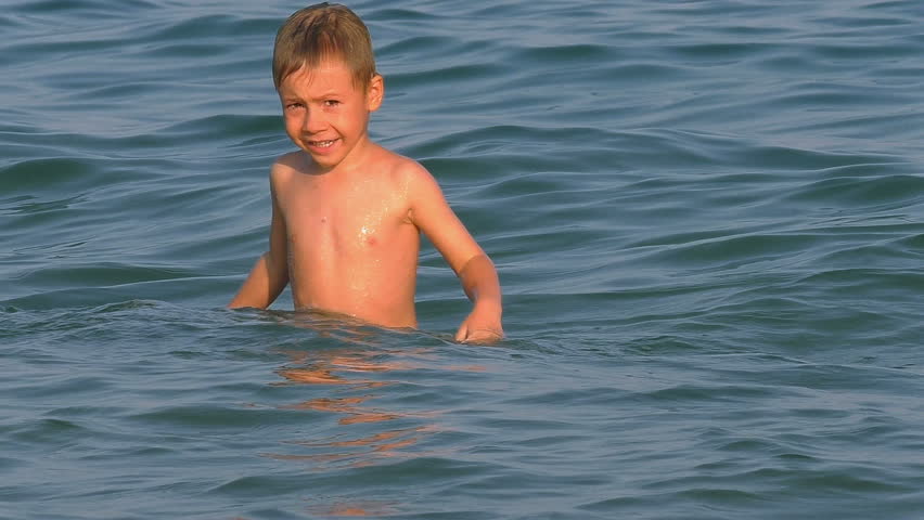 small boy swimming