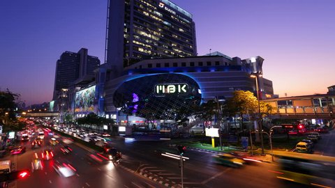 BANGKOK - FEBRUARY 7: (Time lapse view) Traffic in front of MBK Center on February 7, 2012 in Bangkok, Thailand.
