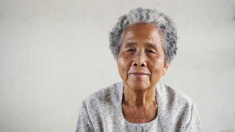 Happy Asian Grandmother on white background, The culture of Asian old women concept