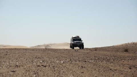 SAHARA DESERT, TUNISIA - CIRCA OCTOBER 2015:  off road cars drive on a  track in the Sahara desert.