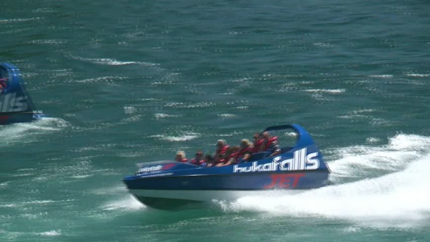 TAUPO, NEW ZEALAND - CIRCA 2011. Unidentified passengers on a jet boat on the