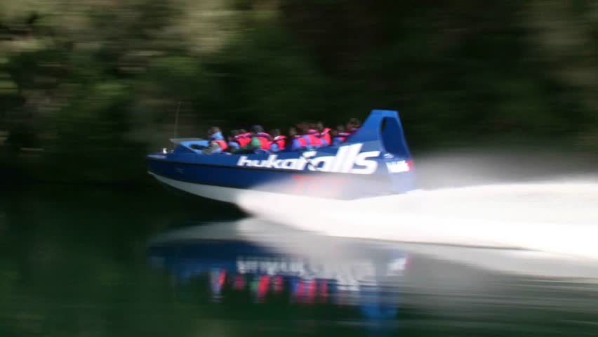 TAUPO, NEW ZEALAND -CIRCA 2011. Unidentified passengers on a jet boat on the