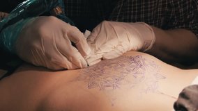 Tattoo master making a tattoo of mandala pattern. Close up shot of hands - Powered by Shutterstock - Get 15% off with code: PIKWIZARD15