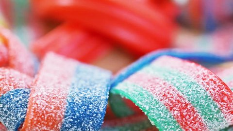 Colorful gummy candy (licorice) rotating sweets background, closeup view Stock Video