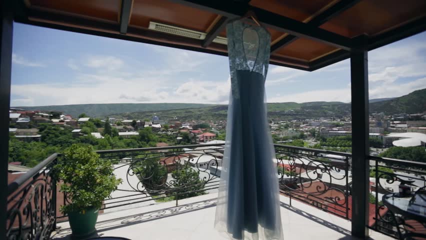 Beautiful dress hanging on the veranda