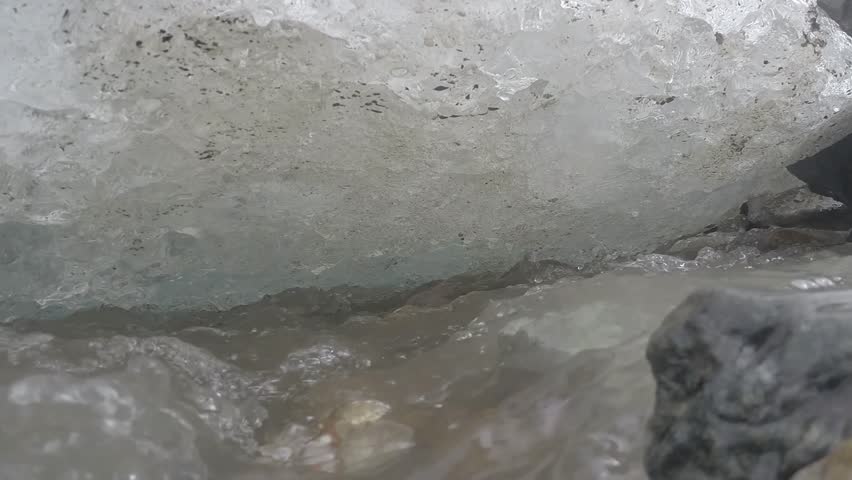 water flowing from the melting ice of the glacier in the massif of Mont Blanc at Punta Indren, Piedmont, Italy.   edited video.