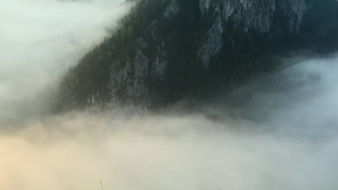 Time lapse of morning fog over countryside landscape