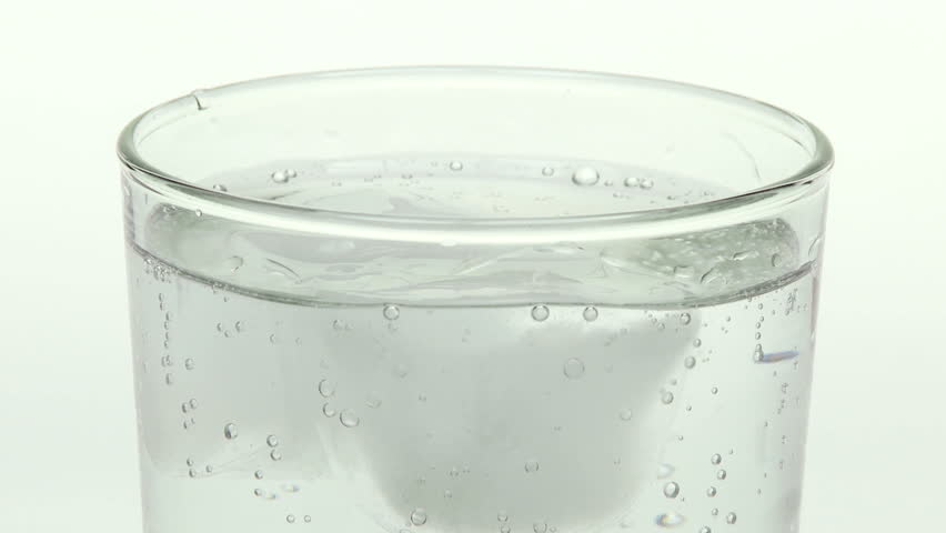 Close up of spring water in glass with ice