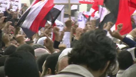 CAIRO, EGYPT - NOV 20: Young protesters in Tahrir Square chant slogans on November 20, 2011 in Cairo, Egypt.