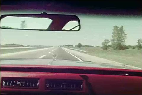 Home movie footage captures scenery on a highway from inside a car as it travels through Ohio in 1976 on a road trip. (1970s)