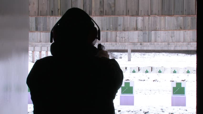 man shooting on target