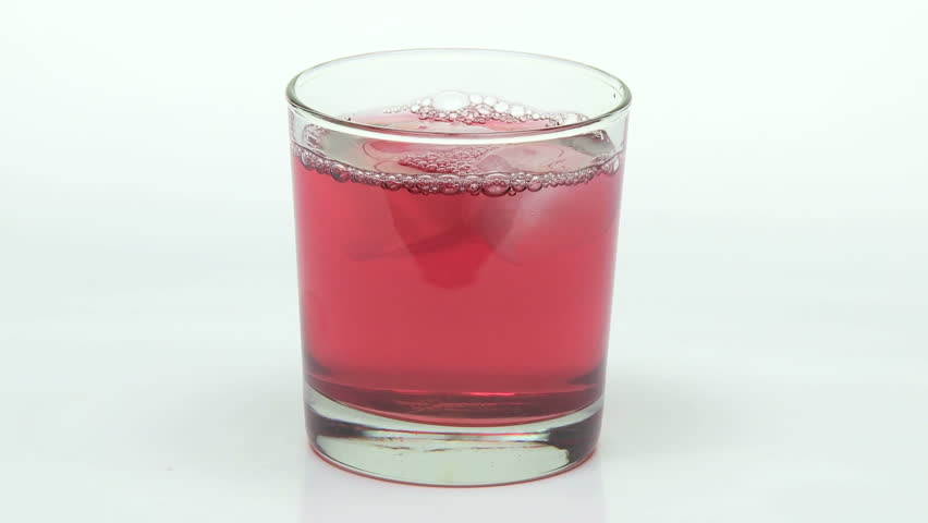 Cranberry juice with ice, close up