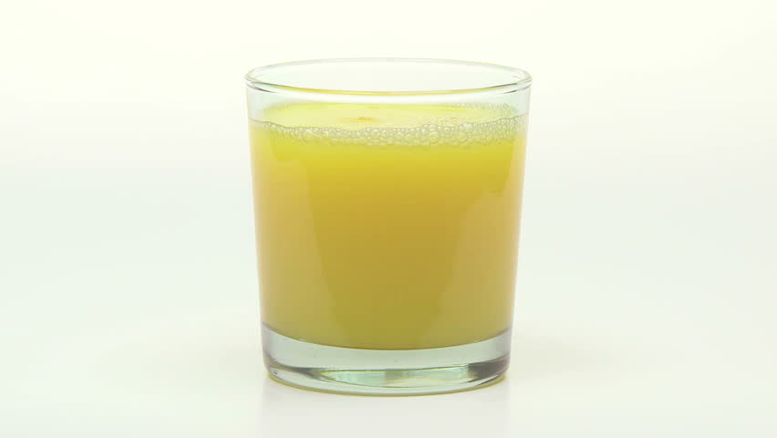 Orange Juice being poured into a glass