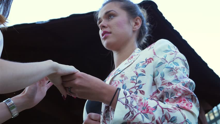 Women are talking about engagement ring one of them. 