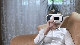 Boy wearing virtual reality goggles HD.