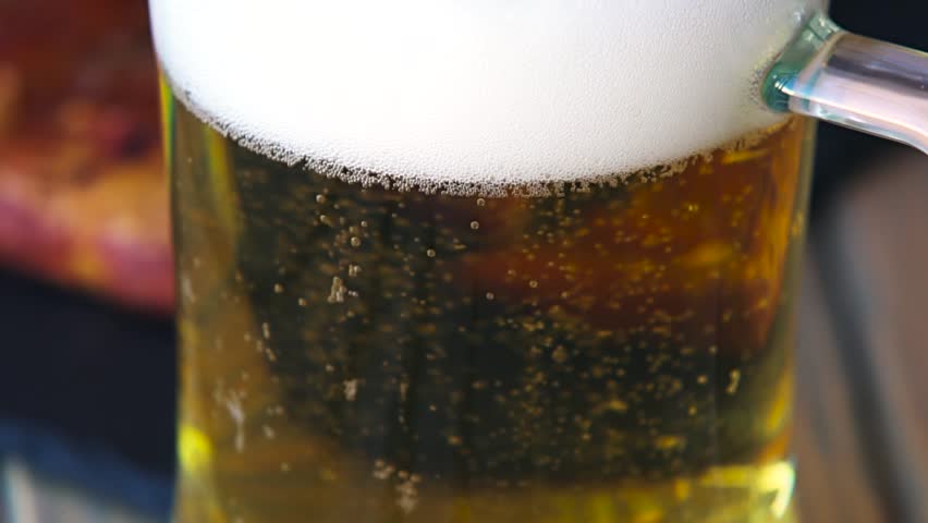 Glass full of beer slow motion bubbles. Beer Bubbles and foam moving fast in glass Royalty-Free Stock Footage #19651489