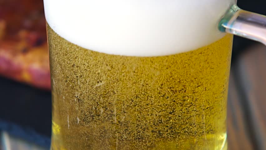 Glass full of beer slow motion bubbles. Beer Bubbles and foam moving fast in glass Royalty-Free Stock Footage #19651492