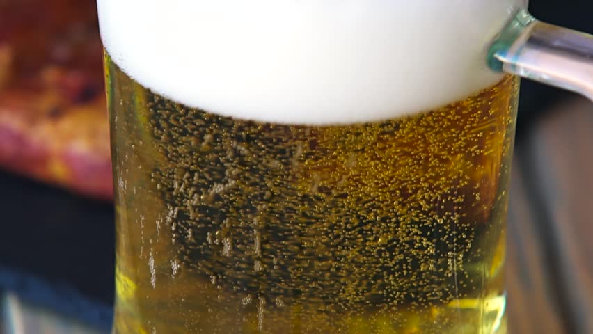 Glass full of beer slow motion bubbles. Beer Bubbles and foam moving fast in glass Royalty-Free Stock Footage #19651537