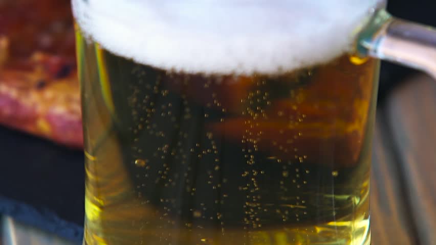 Glass full of beer slow motion bubbles. Beer Bubbles and foam moving fast in glass Royalty-Free Stock Footage #19651552
