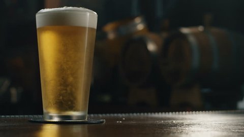 Beer is poured into a glass