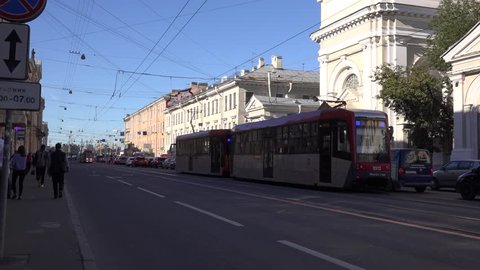 Saint Petersburg, Russia - 13 September 2016. Two-car back-to-back coupled tram trains in traffic jam near the temporary stub terminus at Sportivnaya metro station