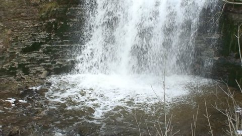 Waterfall on eroded limestone rock