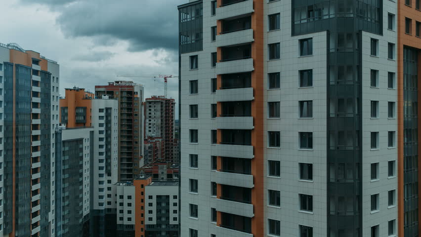 Multi-storey residential buildings, sleeping area. movement of clouds on a background of urban buildings. day time lapse video in cloudy weather. camera movement from the bottom up | Shutterstock HD Video #19660399